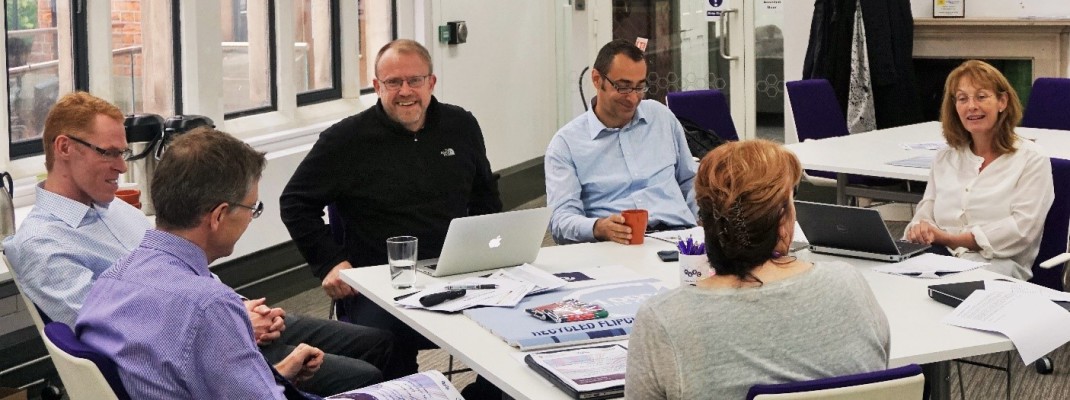 Delegates from Manchester and Harvard take part in a group discussion